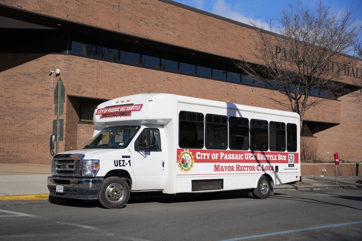 The City of Passaic UEZ Shuttle bus parked in front of Passaic City Hall.